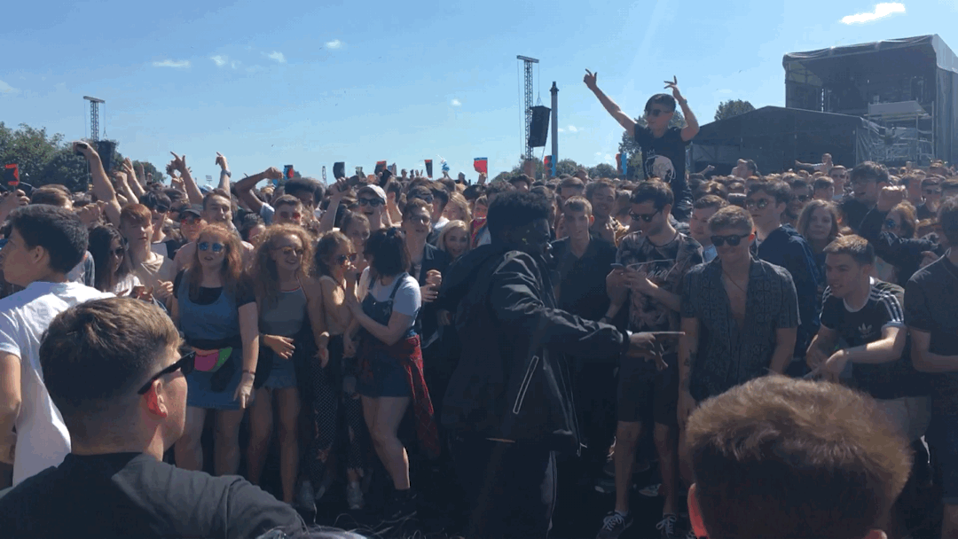 Young people dancing and celebrating in the crowds at TRNSMT festival in Glasgow